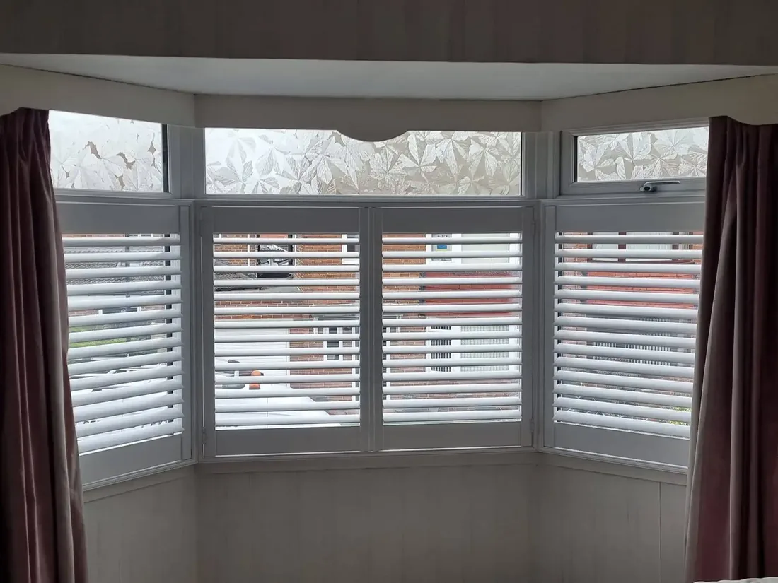 Café-style shutters on a bay window